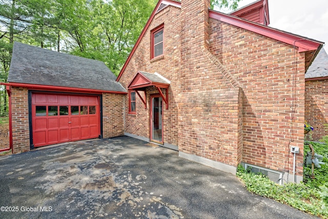 2305 Balltown Rd, Niskayuna, NY 12309 - view of front facade featuring an outbuilding, brick siding, and asphalt driveway