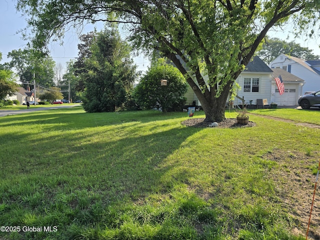 2922 Halsey Dr, Schenectady, NY 12304 - view of green lawn with an attached garage