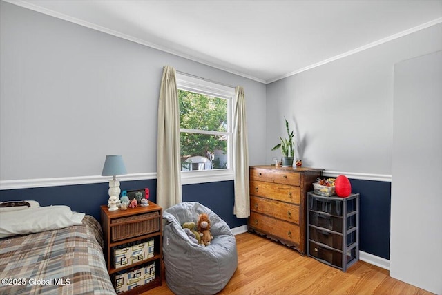 303 E Washington Ave, Rensselaer, NY 12144 - bedroom featuring wood finished floors and crown molding