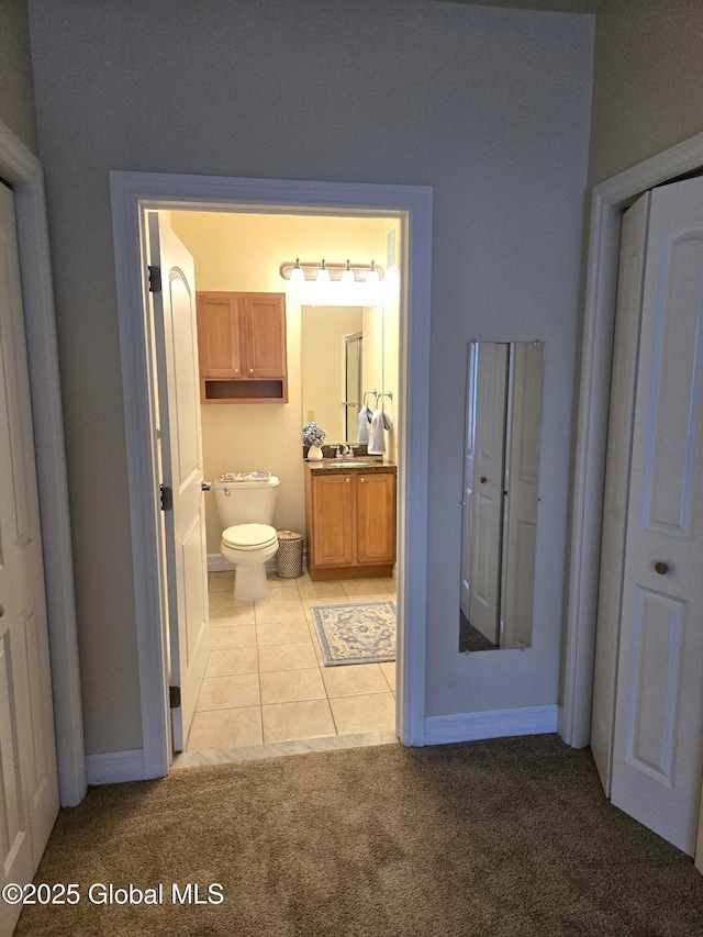 8 Wall St Unit 236, Clifton Park, NY 12065 - bathroom featuring vanity, carpet flooring, and tile patterned floors