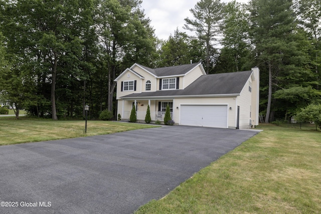 22 Santee Dr, Wilton, NY 12831 - view of front facade with a porch, asphalt driveway, a chimney, a garage, and a front yard
