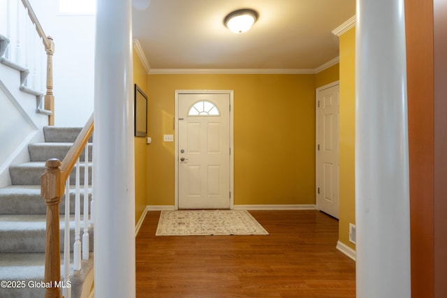 22 Santee Dr, Wilton, NY 12831 - foyer entrance featuring crown molding, wood finished floors, and stairs