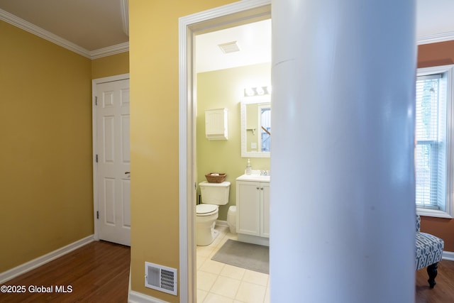 22 Santee Dr, Wilton, NY 12831 - half bathroom featuring vanity, crown molding, and wood finished floors