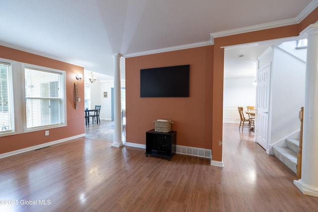 22 Santee Dr, Wilton, NY 12831 - unfurnished living room with decorative columns, wood finished floors, stairway, and ornamental molding