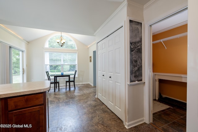 22 Santee Dr, Wilton, NY 12831 - kitchen featuring a chandelier, light countertops, vaulted ceiling, decorative light fixtures, and crown molding