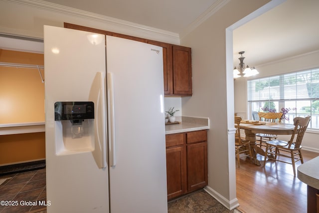 22 Santee Dr, Wilton, NY 12831 - kitchen featuring white fridge with ice dispenser, a chandelier, ornamental molding, brown cabinetry, and light countertops