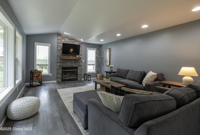 22 Santee Dr, Wilton, NY 12831 - living room featuring lofted ceiling, healthy amount of natural light, a stone fireplace, dark wood-type flooring, and recessed lighting