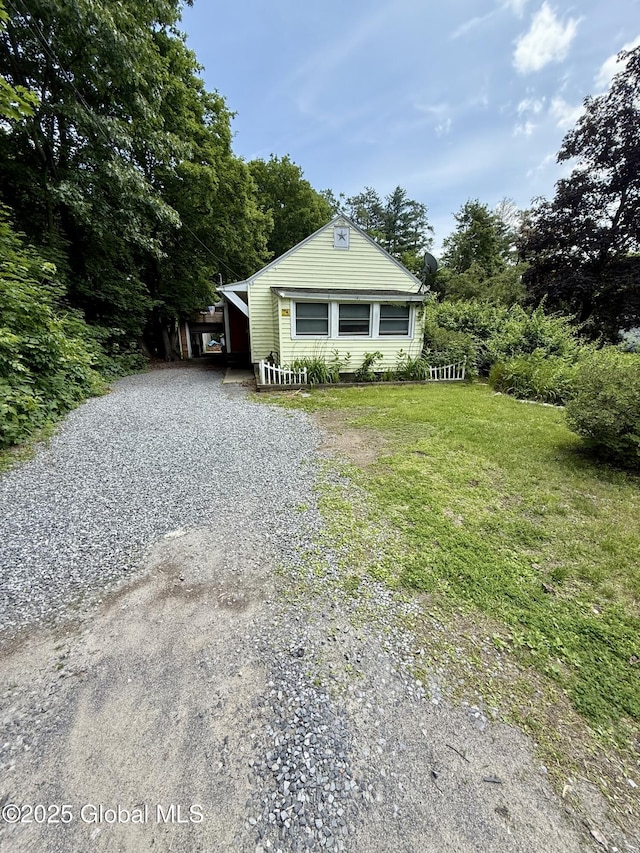 1612 Rte 9, Moreau, NY 12828 - bungalow-style home featuring gravel driveway and a front yard