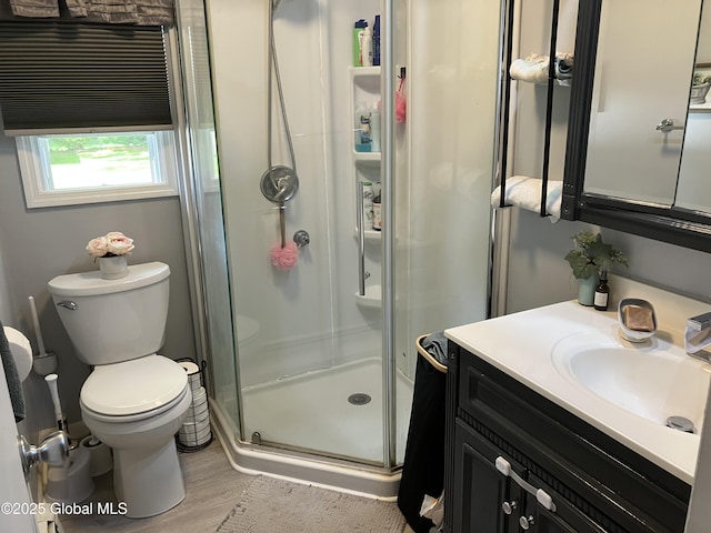 185 Butler St, Schenectady, NY 12303 - bathroom featuring a stall shower, vanity, and wood finished floors
