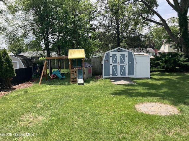 185 Butler St, Schenectady, NY 12303 - fenced yard featuring a storage unit and a playground