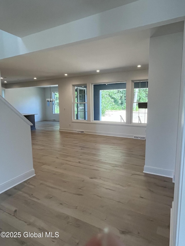 LOT19 Windrow Way, Halfmoon, NY 12118 - unfurnished living room featuring wood finished floors, recessed lighting, and healthy amount of natural light