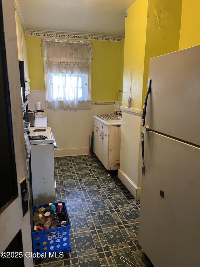 13 Wheeler, Canajoharie Village, NY 13317 - kitchen with freestanding refrigerator, electric stove, and dark floors