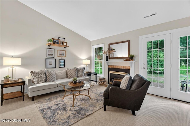 16 Whispering Pines Rd, Wilton, NY 12831 - living room with carpet, lofted ceiling, plenty of natural light, and a fireplace with flush hearth