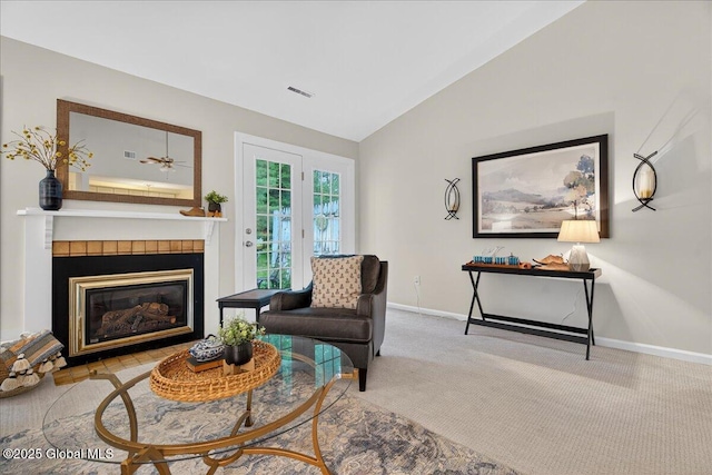 16 Whispering Pines Rd, Wilton, NY 12831 - living room with lofted ceiling, a tile fireplace, and carpet