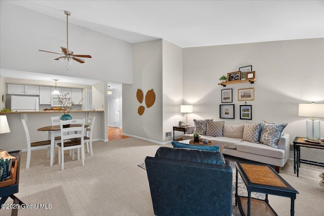 16 Whispering Pines Rd, Wilton, NY 12831 - living room with light colored carpet, lofted ceiling, and ceiling fan