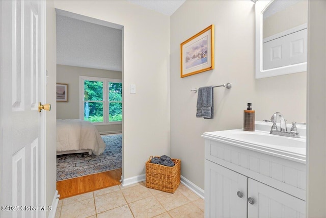 16 Whispering Pines Rd, Wilton, NY 12831 - ensuite bathroom featuring vanity and tile patterned flooring