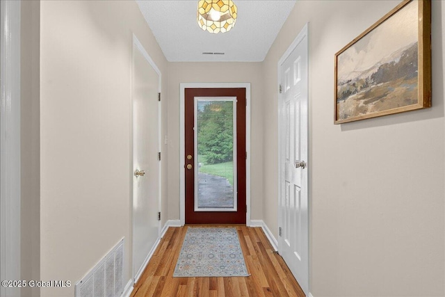 16 Whispering Pines Rd, Wilton, NY 12831 - doorway to outside with light wood-style flooring and baseboards