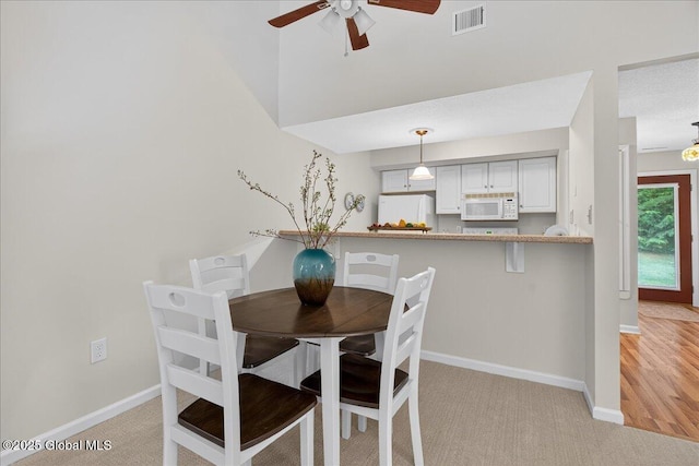 16 Whispering Pines Rd, Wilton, NY 12831 - dining space with ceiling fan and light carpet