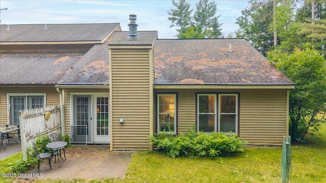 16 Whispering Pines Rd, Wilton, NY 12831 - rear view of house with a patio, roof with shingles, and a yard
