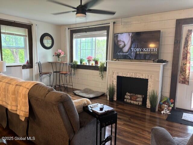 600 State Highway 309, Gloversville, NY 12078 - living room featuring wood finished floors, ceiling fan, and a brick fireplace