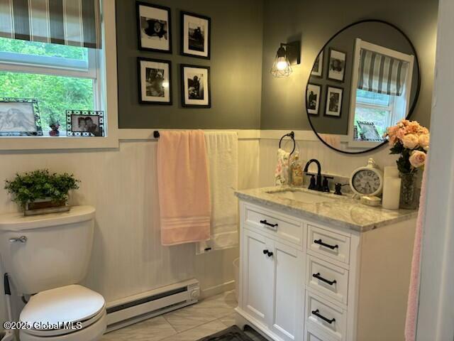 600 State Highway 309, Gloversville, NY 12078 - bathroom with baseboard heating, vanity, and wainscoting
