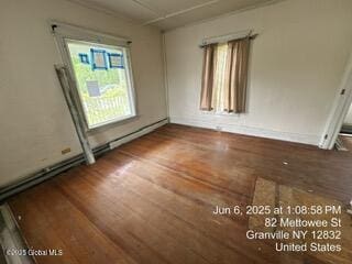 82 Mettowee St, Granville, NY 12832 - spare room with wood finished floors and a baseboard radiator