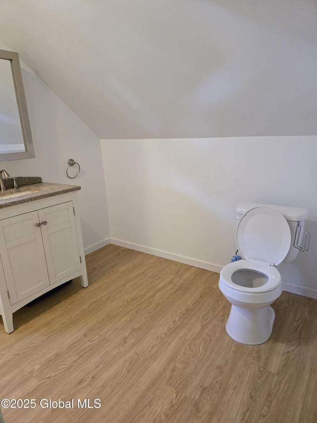 218 Sixteenth St, Schenectady, NY 12306 - bathroom with vaulted ceiling, vanity, and wood finished floors