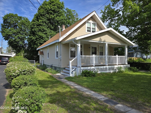 218 Sixteenth St, Schenectady, NY 12306 - bungalow-style house featuring covered porch and a chimney