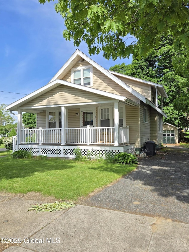 218 Sixteenth St, Schenectady, NY 12306 - view of front of home featuring a porch, a front lawn, and driveway