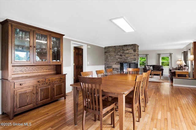 344 Fortsville Rd, Moreau, NY 12831 - dining space with light wood finished floors and a fireplace