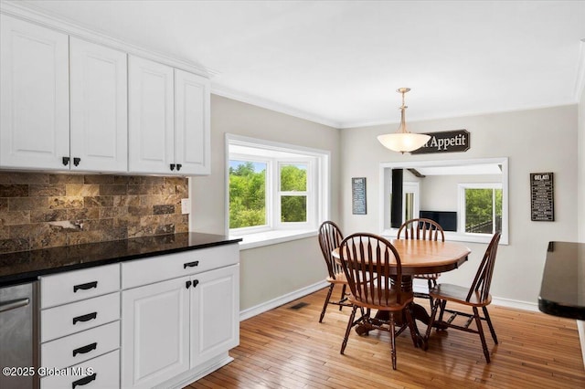 344 Fortsville Rd, Moreau, NY 12831 - dining room with light wood finished floors and ornamental molding