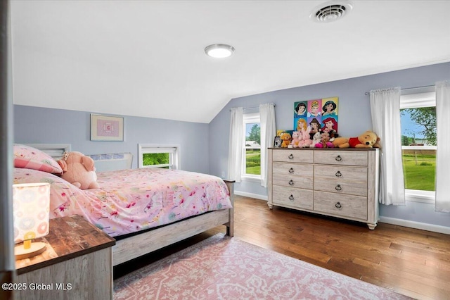 344 Fortsville Rd, Moreau, NY 12831 - bedroom with vaulted ceiling and dark wood finished floors