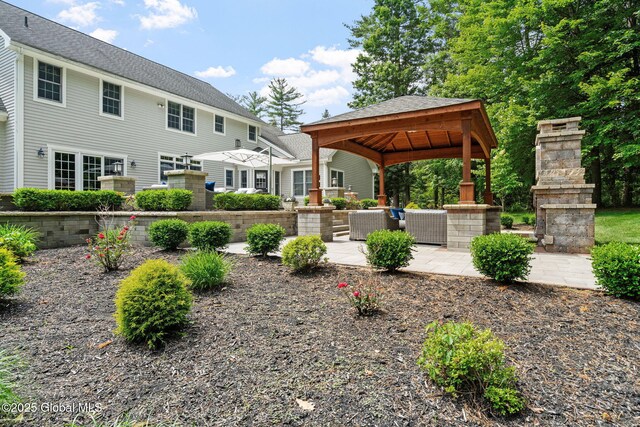 428 Ridgehill Rd, Guilderland, NY 12303 - view of yard featuring a gazebo, an outdoor stone fireplace, and a patio