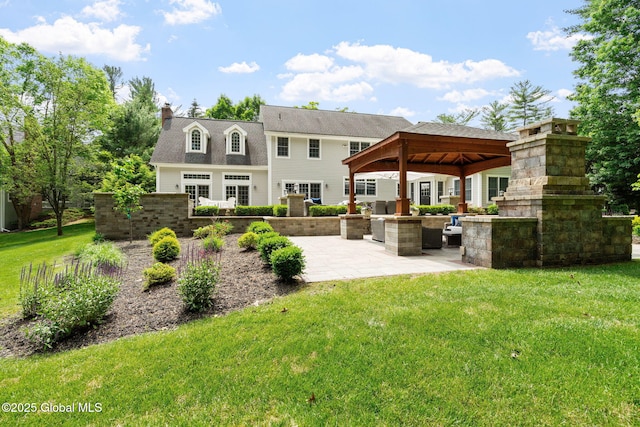 428 Ridgehill Rd, Guilderland, NY 12303 - back of house with a gazebo, a patio area, a lawn, and a chimney