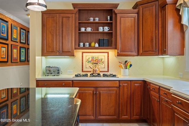428 Ridgehill Rd, Guilderland, NY 12303 - kitchen featuring stainless steel gas cooktop, tasteful backsplash, open shelves, crown molding, and brown cabinetry