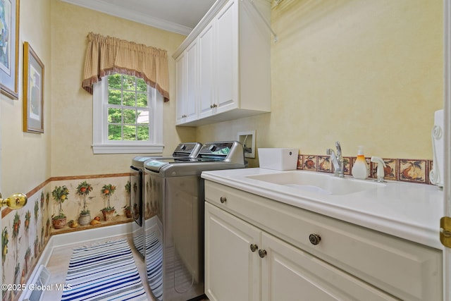 428 Ridgehill Rd, Guilderland, NY 12303 - laundry area with separate washer and dryer, cabinet space, and crown molding