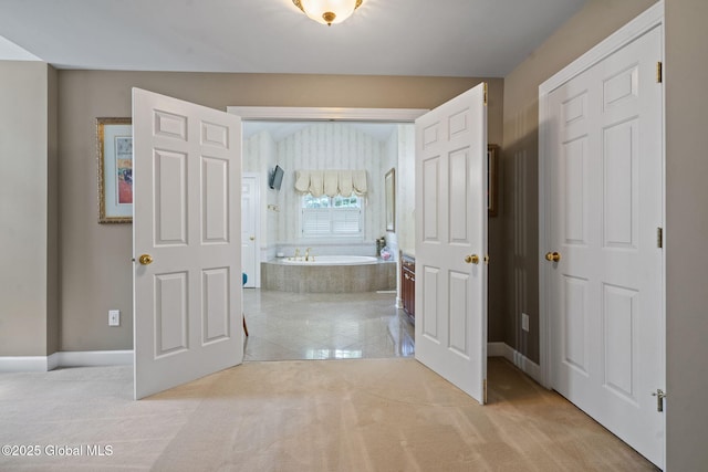 428 Ridgehill Rd, Guilderland, NY 12303 - hallway featuring light colored carpet and light tile patterned floors