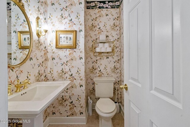 428 Ridgehill Rd, Guilderland, NY 12303 - half bathroom featuring wallpapered walls and tile patterned flooring