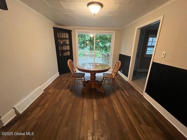 27 Emery Ave, Colonie, NY 12205 - dining room featuring crown molding and dark wood-type flooring
