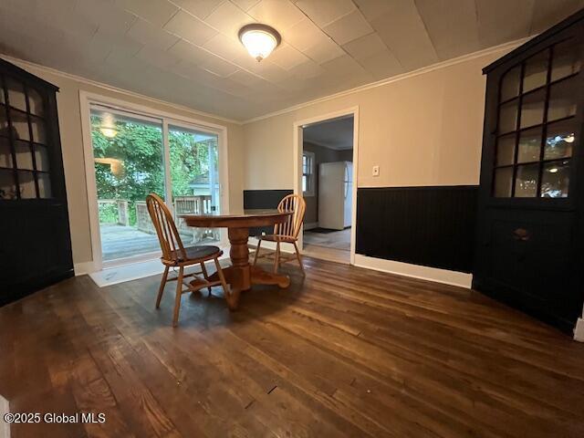 27 Emery Ave, Colonie, NY 12205 - dining space with crown molding, dark wood-style floors, and wainscoting