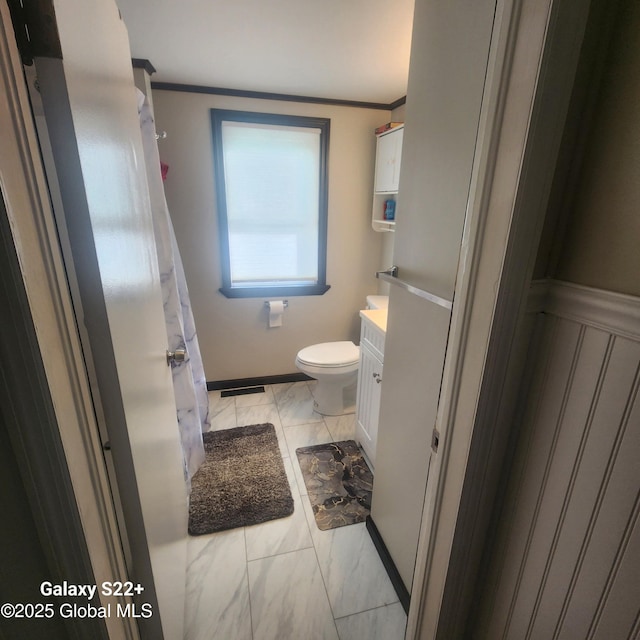 27 Emery Ave, Colonie, NY 12205 - full bathroom featuring vanity, marble look tile flooring, and ornamental molding