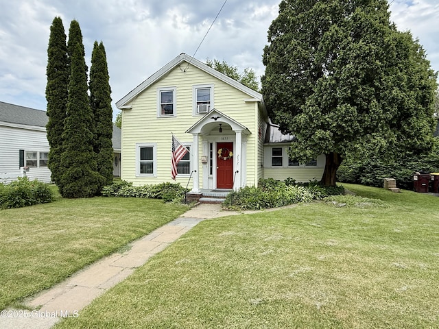 252 Main St, Hudson Falls, NY 12839 - traditional-style home featuring a front lawn and a standing seam roof