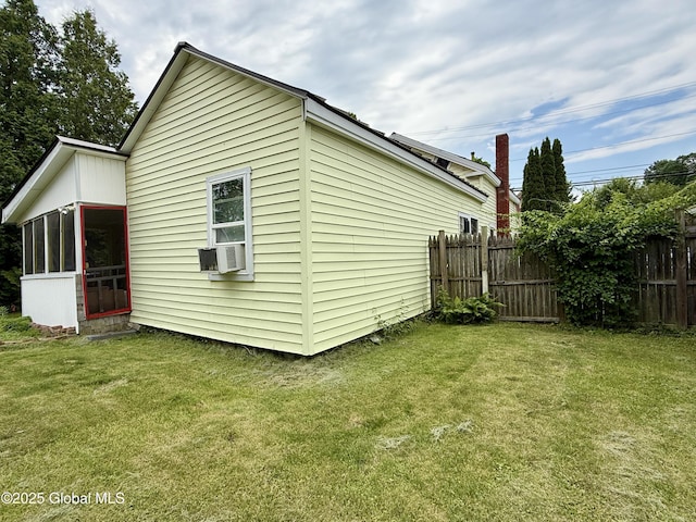 252 Main St, Hudson Falls, NY 12839 - view of property exterior featuring a sunroom and cooling unit