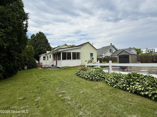 252 Main St, Hudson Falls, NY 12839 - rear view of property with a sunroom and a storage shed