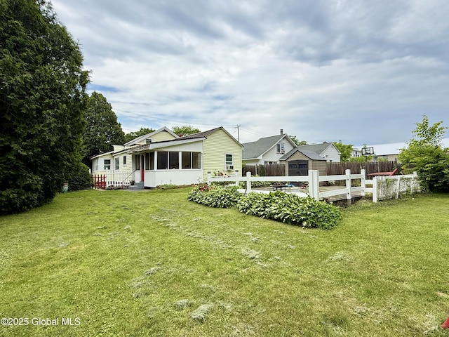 252 Main St, Hudson Falls, NY 12839 - rear view of house featuring a sunroom