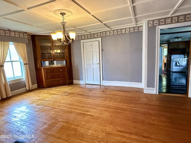 252 Main St, Hudson Falls, NY 12839 - unfurnished dining area featuring a chandelier and light wood-type flooring