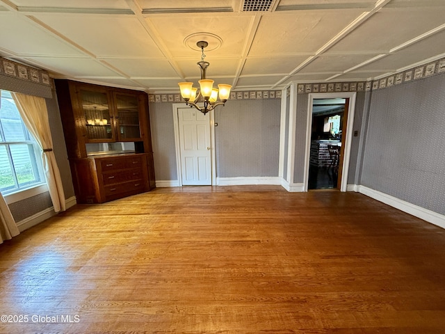 252 Main St, Hudson Falls, NY 12839 - unfurnished dining area featuring light wood-style floors and a chandelier
