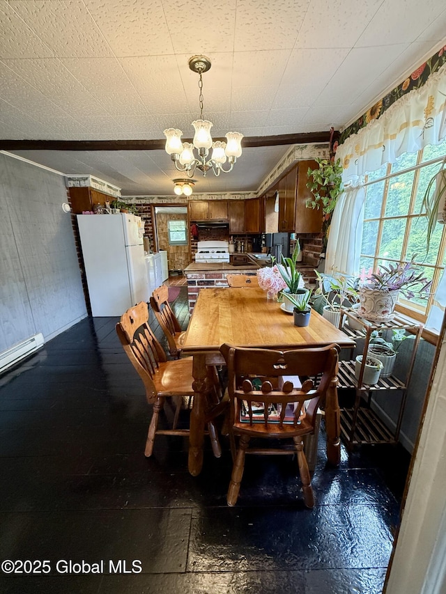 252 Main St, Hudson Falls, NY 12839 - dining space featuring a chandelier and wood walls