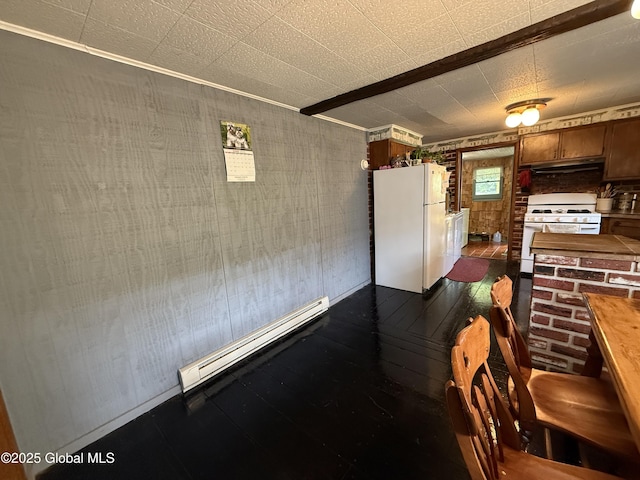 252 Main St, Hudson Falls, NY 12839 - dining area with baseboard heating and dark wood-type flooring