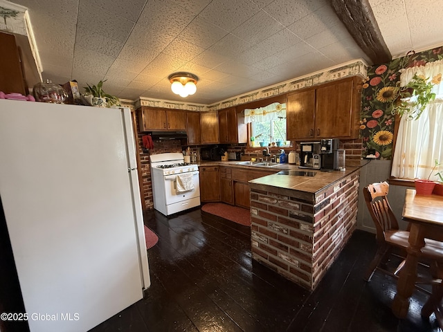 252 Main St, Hudson Falls, NY 12839 - kitchen with white appliances, tile counters, range hood, dark wood-type flooring, and brown cabinets